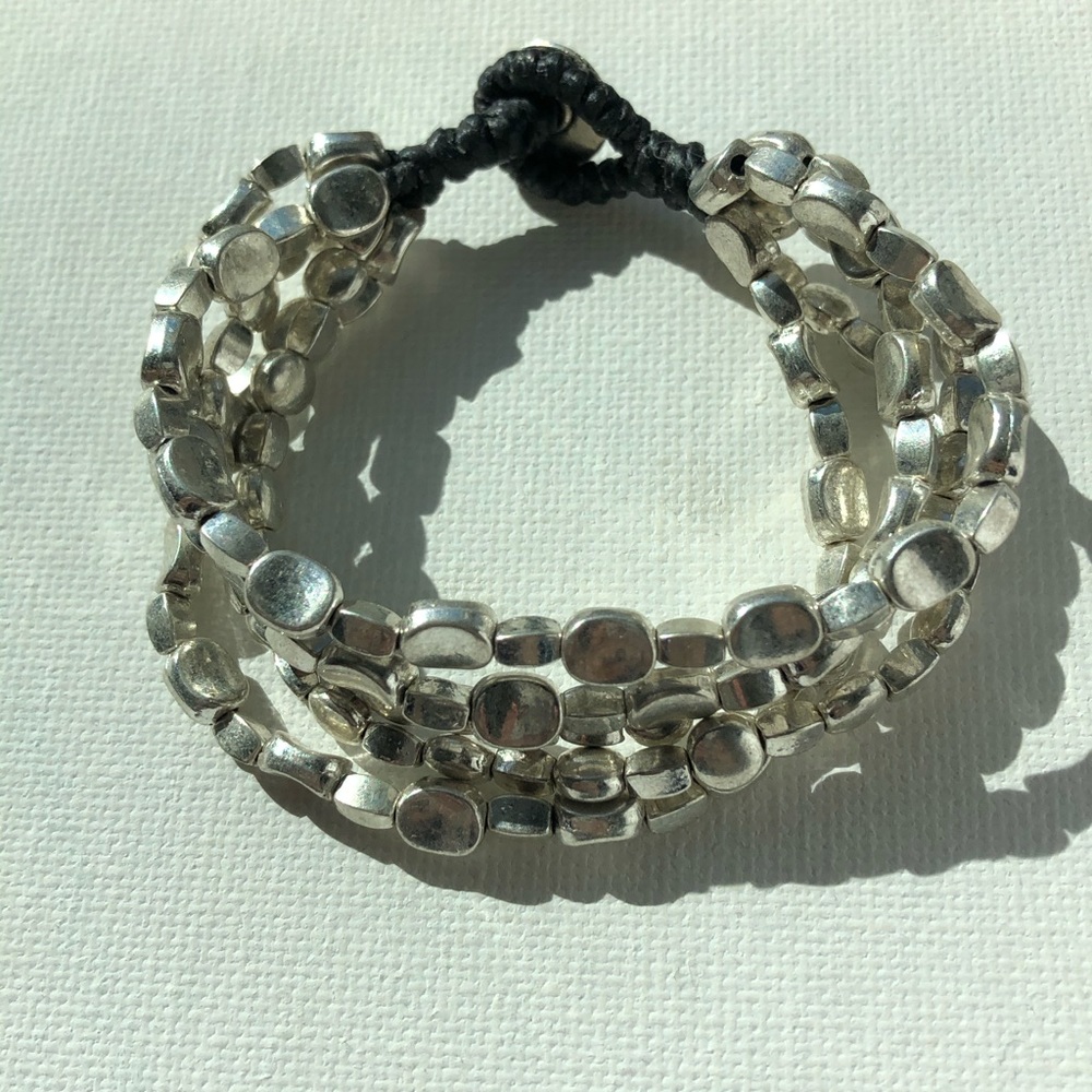 Five strands of Oval Silver Beads